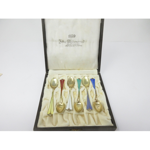 107 - Six Norwegian silver and various coloured enamel Coffee Spoons, in case