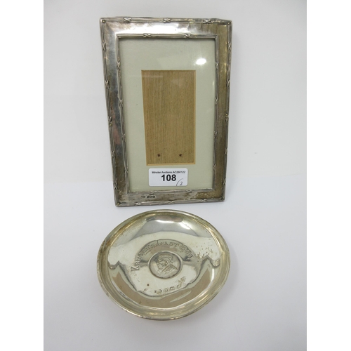 108 - A George V silver Photograph Frame, Birmingham 1916 and a silver Trinket Dish inset coin, 'Kruger's ... 