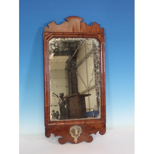 12 - An 18th Century walnut Wall Mirror with shaped frame and brass candle sconce 1ft 10in H x 11in W