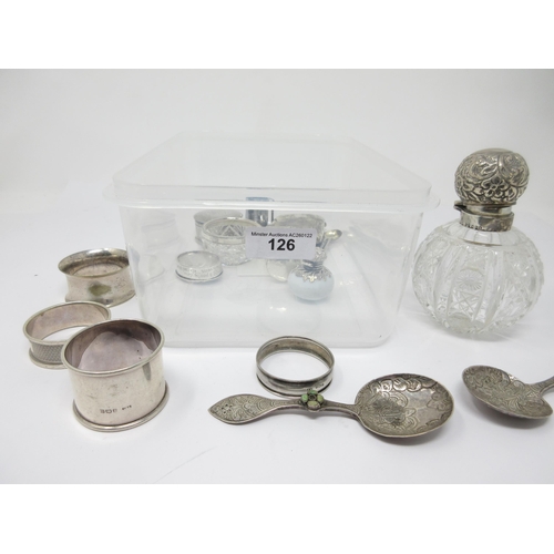 126 - A silver lidded cut glass Scent Bottle, a silver Cigarette Case, three silver Napkin Rings, two fore... 