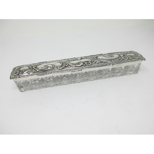 129 - An Edward VII silver lidded cut glass Hat Pin Box with floral and scroll embossing, Birmingham 1904,... 