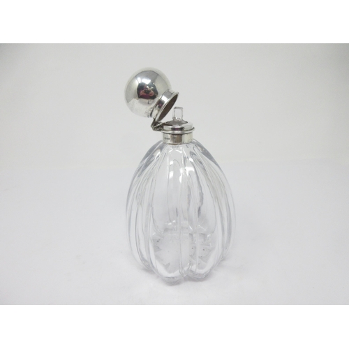 136 - A 'silver' lidded glass Scent Bottle and Stopper of lobed form