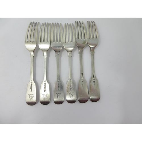 141 - Four William IV silver Dessert Forks fiddle pattern engraved crests, Exeter 1835 and two others, Lon... 