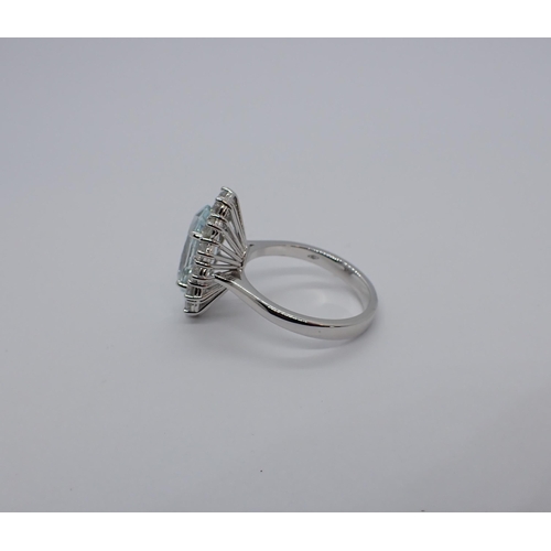 183 - An Aquamarine and Diamond Cluster Ring claw-set oval-cut aquamarine, 2.43cts, within frame of fourte... 