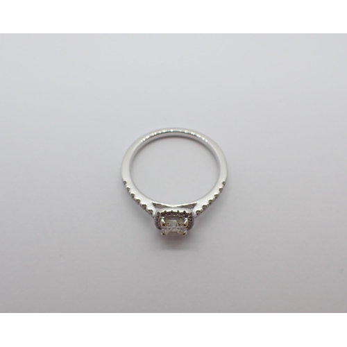 188 - A Diamond halo Cluster Ring corner claw-set square asscher-cut stone, 0.39cts, within a frame of bri... 