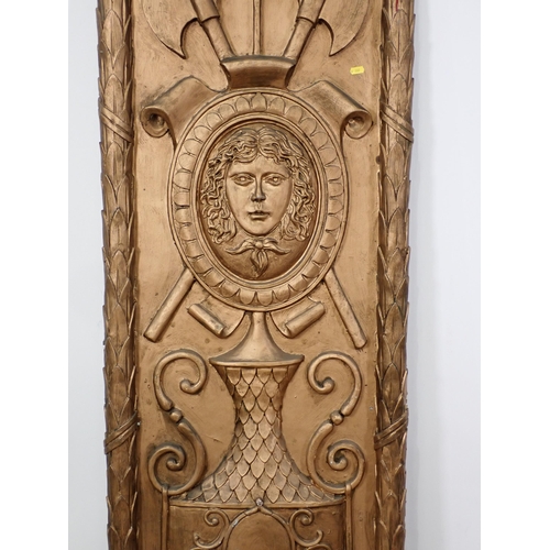 20 - A gilt painted fibreglass theatrical screen Panel decorated with relief moulded Pagan mask and urn i... 