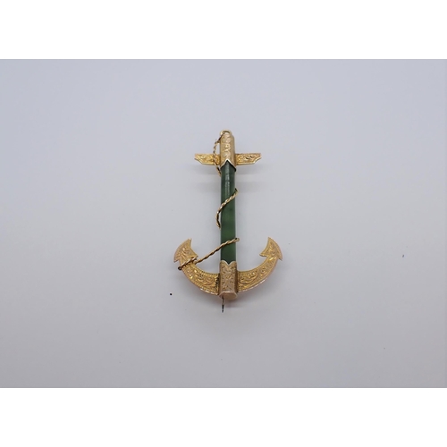 211 - An Anchor Brooch having jade shaft and engraved yellow metal mounts, stamped 9