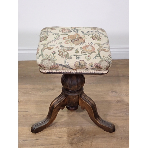 252 - A revolving Piano Stool with upholstered seat