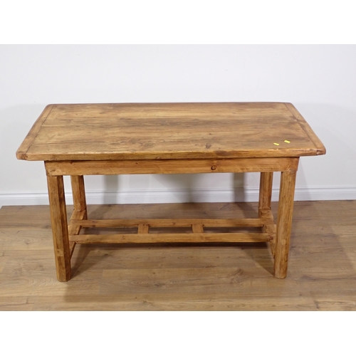 260 - A rustic pine Kitchen Table with cleated top mounted on chamfered supports with double stretcher 4ft... 