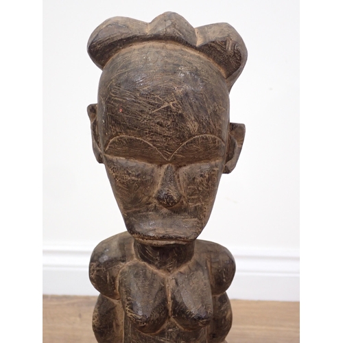 269 - A West African carving of a female figure on stand 1ft 10in H and an Inuit Figure of a woman with ca... 