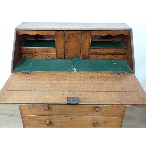 278 - A 19th Century oak Bureau with fall front enclosing interiors of drawers and a cupboard door all abo... 