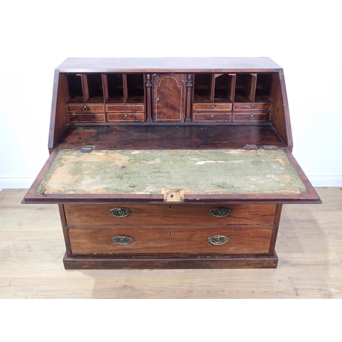 300 - A 19th Century mahogany Bureau with fall front enclosing a fitted interior of inlaid drawers flankin... 