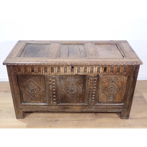 301 - A 17th Century and later joined oak Coffer with sunken three panel lid above nulled frieze with carv... 