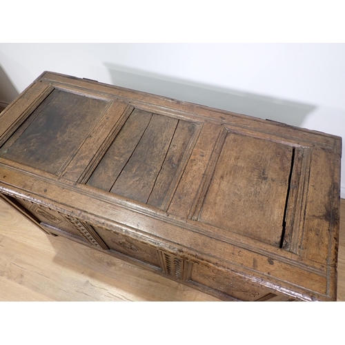 301 - A 17th Century and later joined oak Coffer with sunken three panel lid above nulled frieze with carv... 