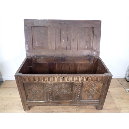 301 - A 17th Century and later joined oak Coffer with sunken three panel lid above nulled frieze with carv... 