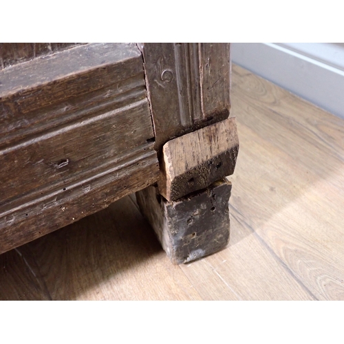 301 - A 17th Century and later joined oak Coffer with sunken three panel lid above nulled frieze with carv... 