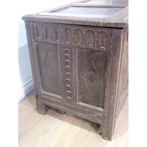 301 - A 17th Century and later joined oak Coffer with sunken three panel lid above nulled frieze with carv... 