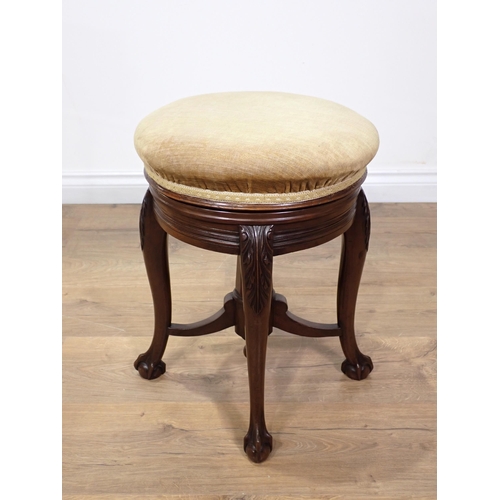 304 - A Victorian mahogany circular Piano Stool on leafage carved cabriole supports stamped James Shoolbre... 