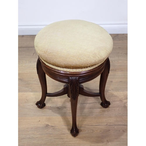 304 - A Victorian mahogany circular Piano Stool on leafage carved cabriole supports stamped James Shoolbre... 