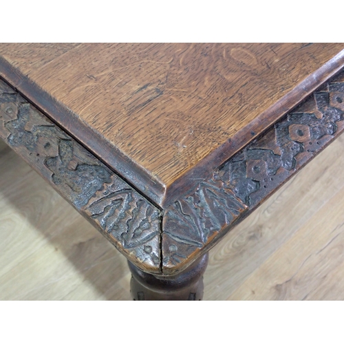 305 - A Victorian oak Library Table with carved edge and frieze mounted upon turned tapering supports 4ft ... 