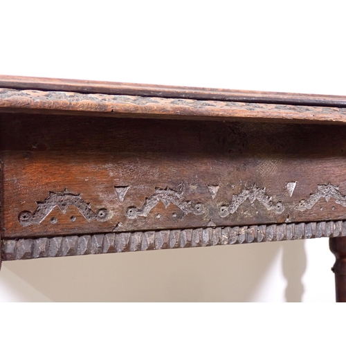 305 - A Victorian oak Library Table with carved edge and frieze mounted upon turned tapering supports 4ft ... 