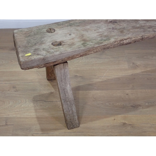 308 - An antique rustic Bench on square cut supports 4ft 10in W x 1ft 4in H