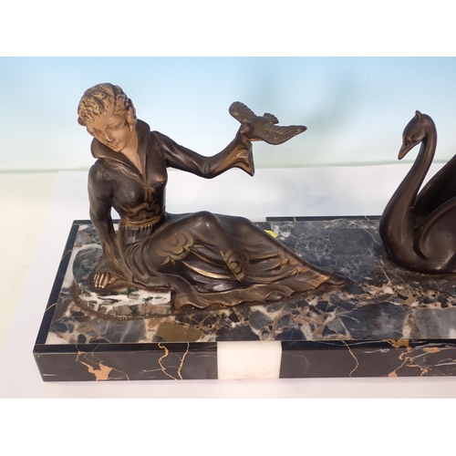 314 - An Art Deco Sculpture of a woman with perched dove and two swans on marble base 1ft 8in L x 7in H