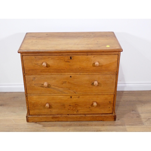 33 - An antique pine Chest of three long drawers on plinth base 2ft 9in W x 2ft 5in H