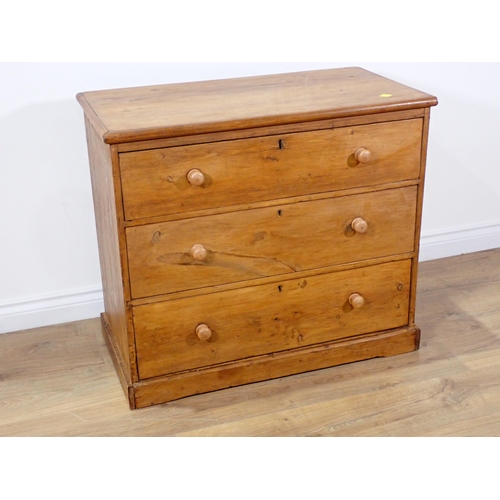 33 - An antique pine Chest of three long drawers on plinth base 2ft 9in W x 2ft 5in H