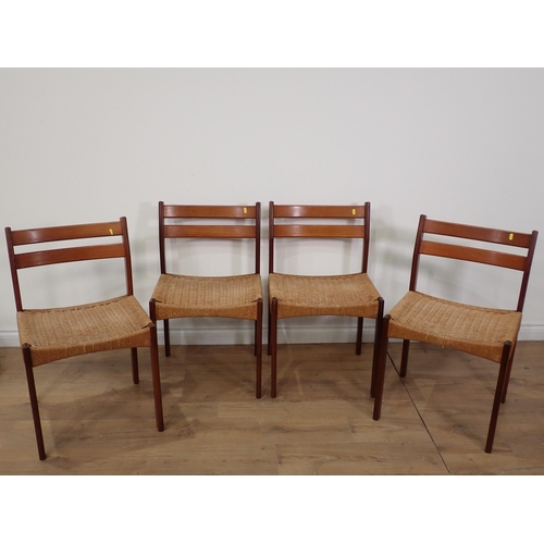 349 - A Danish Teak extending Dining Table by Morgens Kold and four Chairs by String, the table with pull-... 