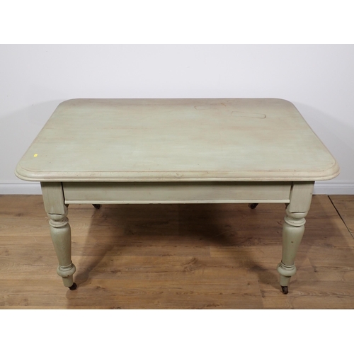 355 - A painted rectangular Kitchen Table with moulded rectangular top on turned supports and casters, 4ft... 