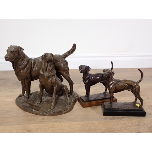 357 - P.A HANN, a bronze effect figure group of two dogs 