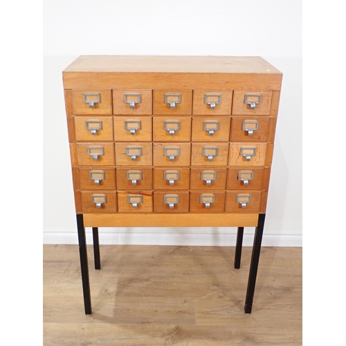 363 - A 20th Century oak bank of twenty Drawers on metal supports 4ft 1in H x 2ft 10in W