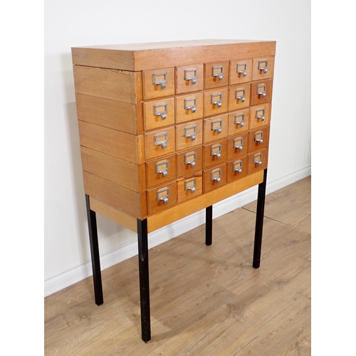 363 - A 20th Century oak bank of twenty Drawers on metal supports 4ft 1in H x 2ft 10in W