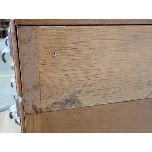 363 - A 20th Century oak bank of twenty Drawers on metal supports 4ft 1in H x 2ft 10in W