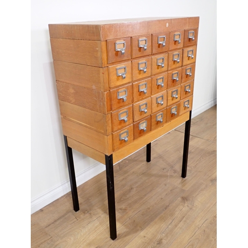 364 - A 20th Century oak bank of twenty Drawers on metal supports 4ft 1in H x 2ft 10in W