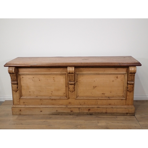 369 - An antique pine Haberdashery Shop Counter with mahogany top inset with brass ruler fitted two banks ... 