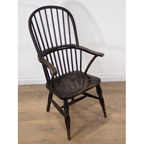 373 - An antique stained ash and elm stick back Thames Valley type Armchair on turned supports and H-stret... 