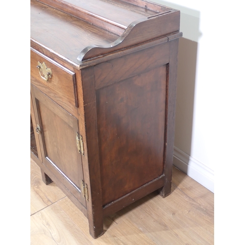 450 - An antique oak dog kennel Dresser Base in the 18th Century style fitted three drawers above a pair o... 