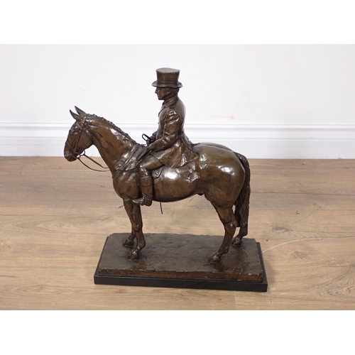 464 - A bronze effect Sculpture of a mounted Huntsman 1ft 3in H