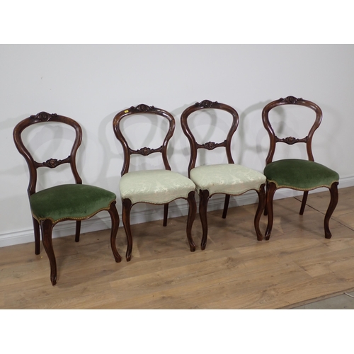 47 - A set of four Victorian walnut balloon back Chairs