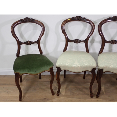 47 - A set of four Victorian walnut balloon back Chairs