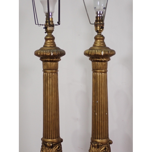 480 - A pair of large gilt Table Lamps with moulded frieze of cherubs beneath fluted columns 3ft 1in H (fa... 