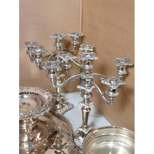 484 - A quantity of plated ware including pair of Table Candelabra, pierced Bon-bon Dish, Tray, etc. and v... 