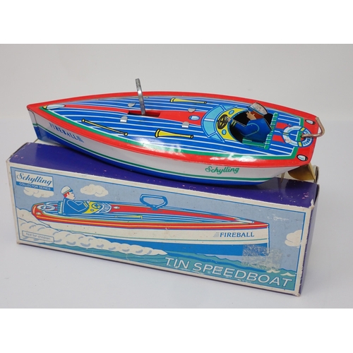 175 - A boxed Schylling Tin Speedboat and a boxed Plasticart Limousine Fire Chief Car