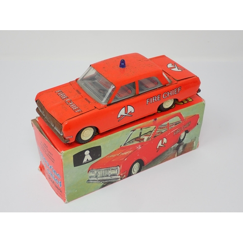 175 - A boxed Schylling Tin Speedboat and a boxed Plasticart Limousine Fire Chief Car