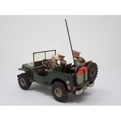 179 - An Arnold tinplate friction driven J-2500 Military Police Jeep