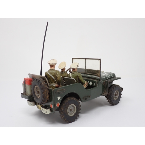 179 - An Arnold tinplate friction driven J-2500 Military Police Jeep