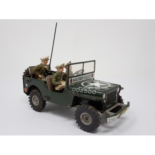 179 - An Arnold tinplate friction driven J-2500 Military Police Jeep