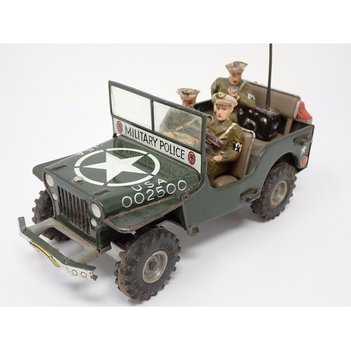 179 - An Arnold tinplate friction driven J-2500 Military Police Jeep